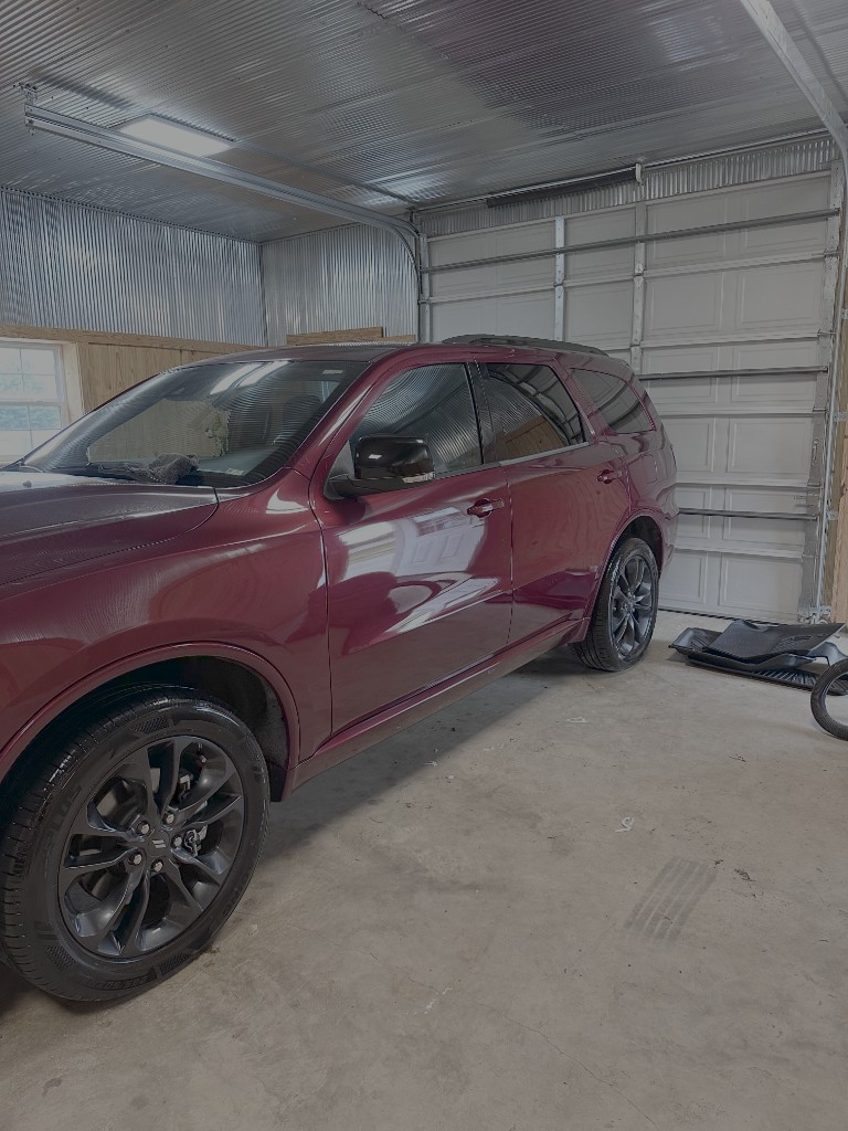 Freshly detailed deep red SUV at FNF Auto Spa